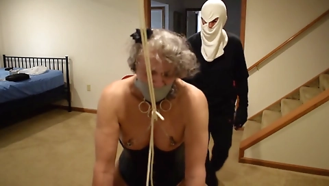 Mature woman with a dildo fucks